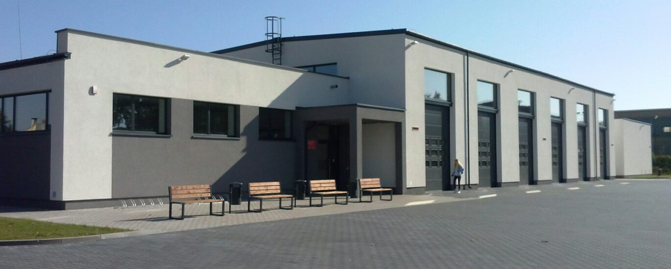 a building that has a lot of benches in front of it